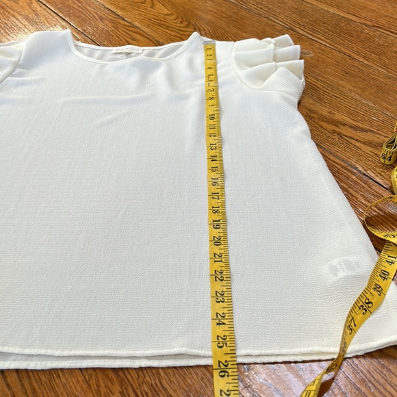 Perfect Peach cream color ruffle sleeve top.  Size Large.  Excellent condition. - Picture 8 of 10